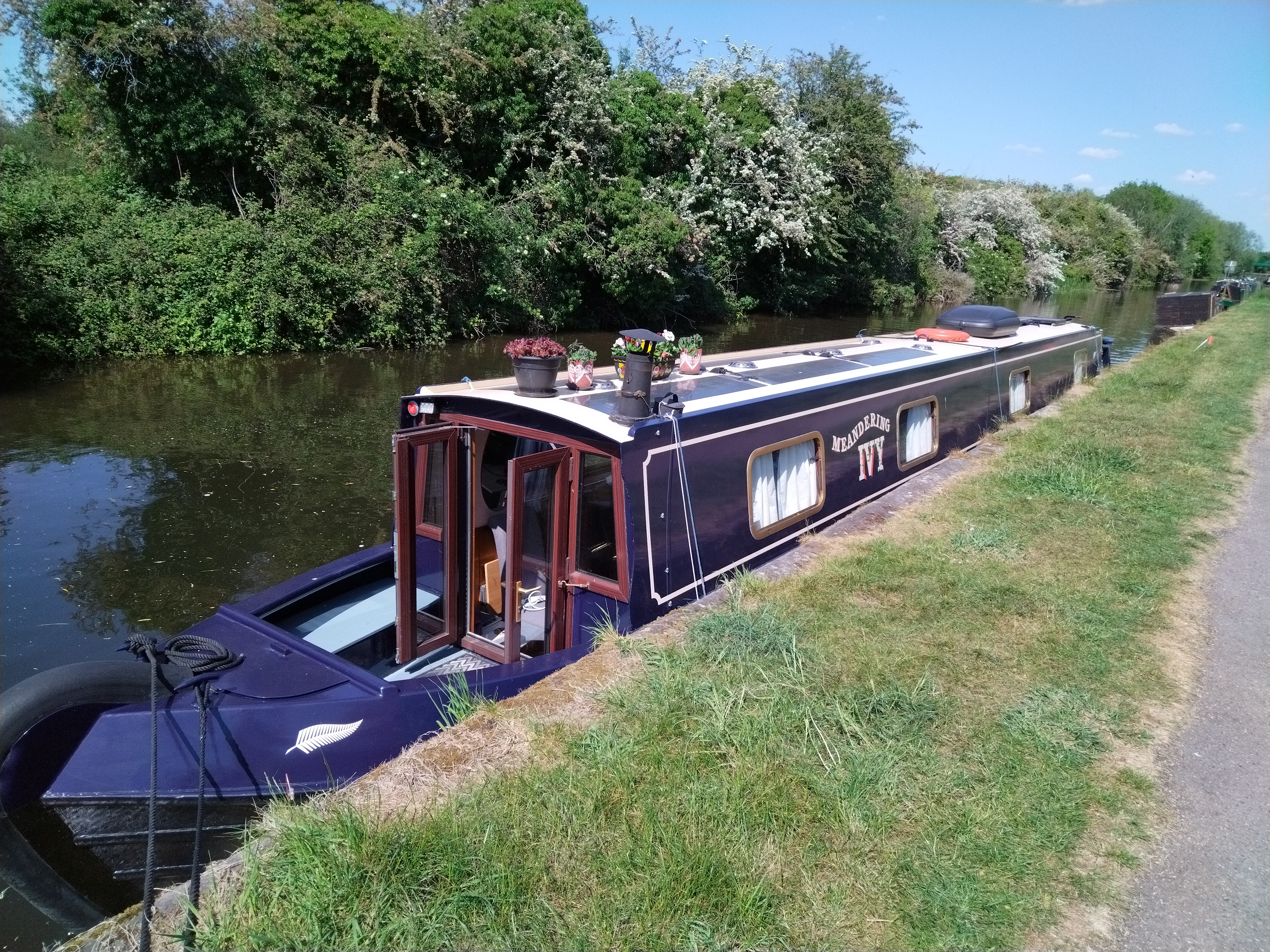 dark blue canal boat moored on nottingham beeston waterways